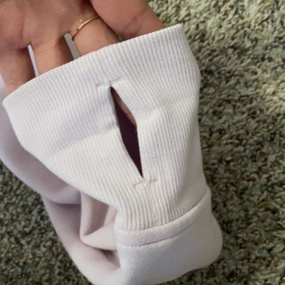 This is a light pink lululemon athletic jacket. It is a size 8. - Picture 3 of 4